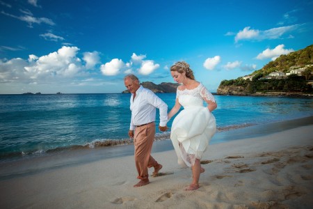 The bride and groom couldn't resist putting their toes in the sand on Flamands Beach