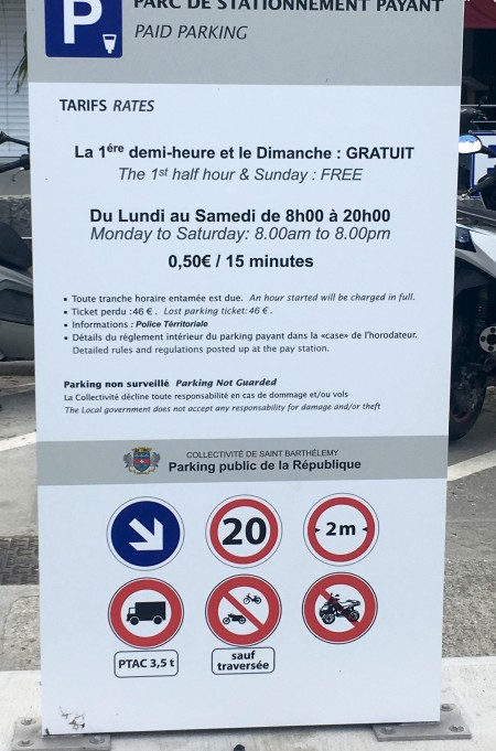 This sign showing the rules, regulations and tariffs is at the entrance to to paid parking lot by the ferry dock.